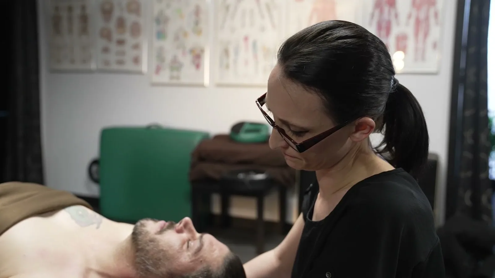 A St. Moritz student practicing massage technique under supervision